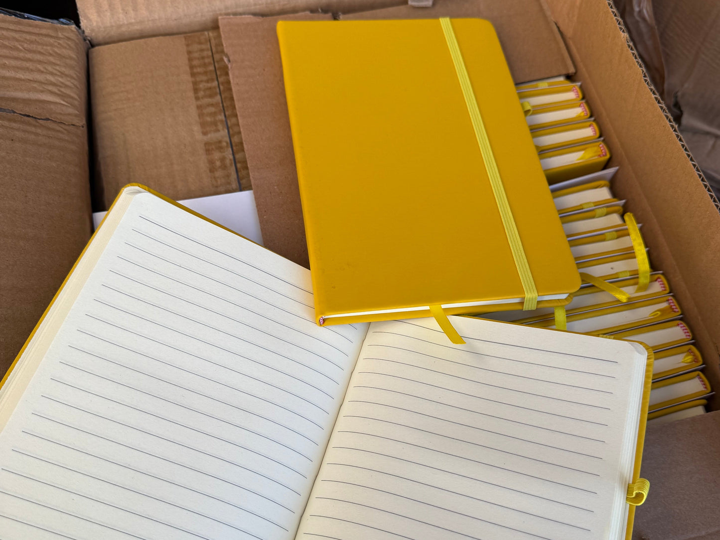 Box Of 50 Yellow PU A5 Hardback Notebooks
