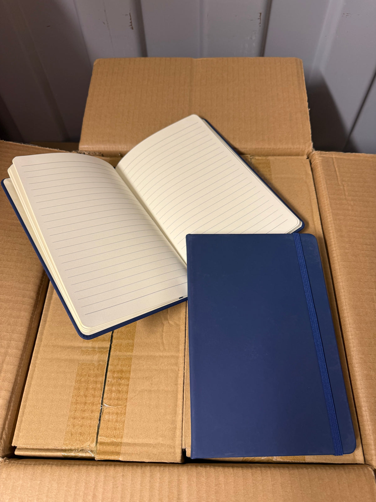 A5 PU hardback notebooks with elastic closure, bundles of 10 or full boxes of 50
