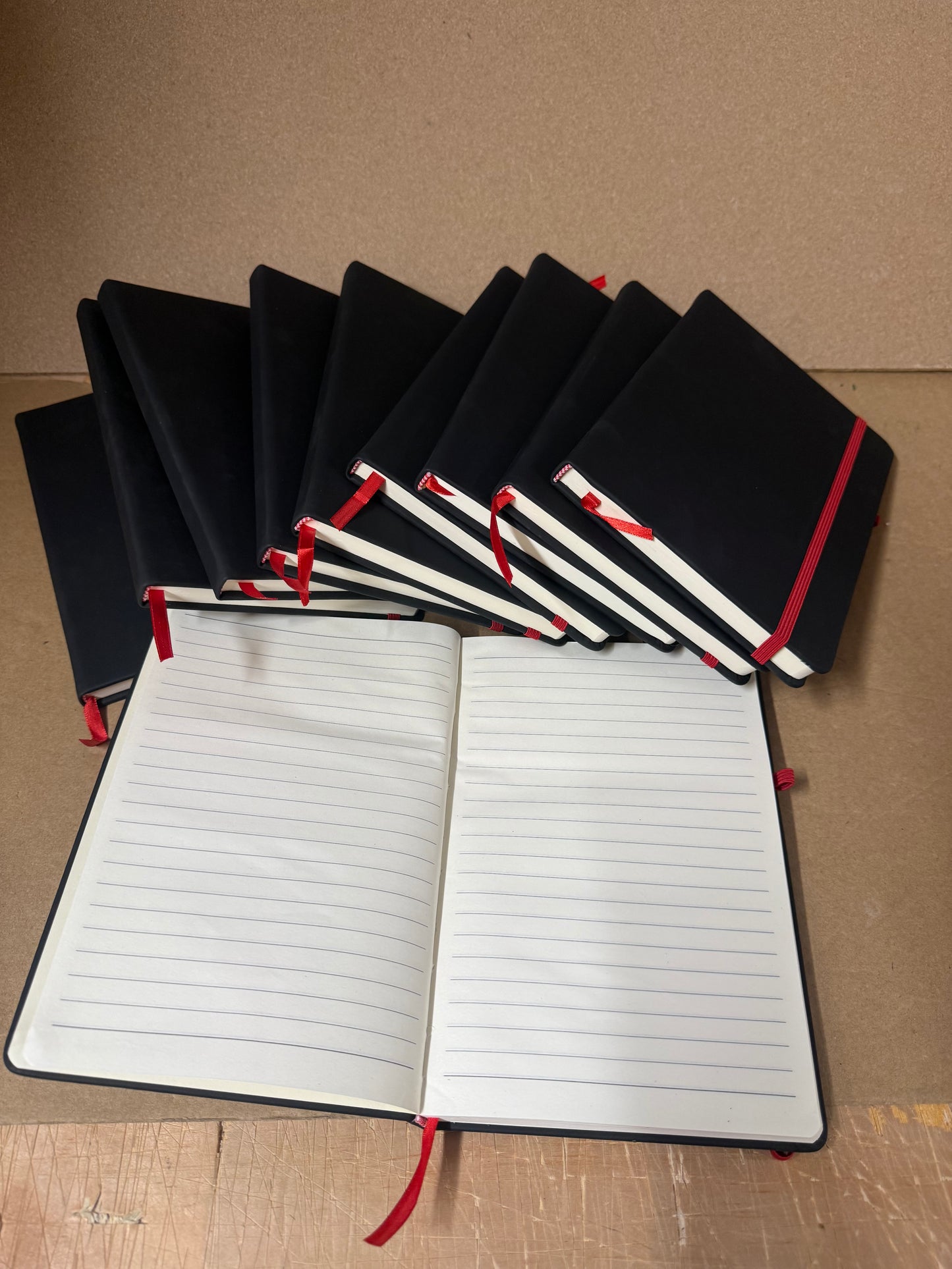 Bundle of Black A5 PU hardbacked notebooks with coloured closure