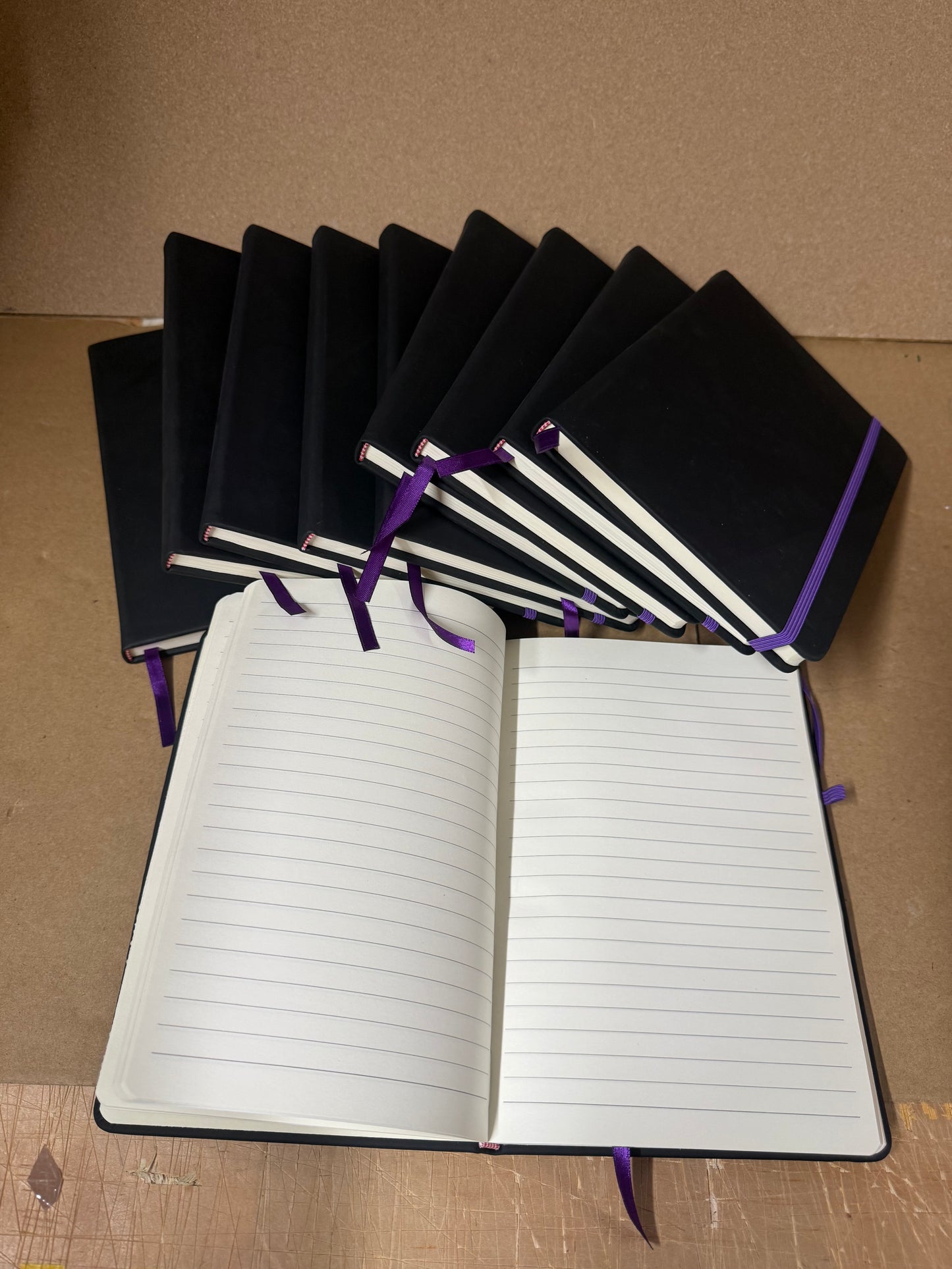 Bundle of Black A5 PU hardbacked notebooks with coloured closure