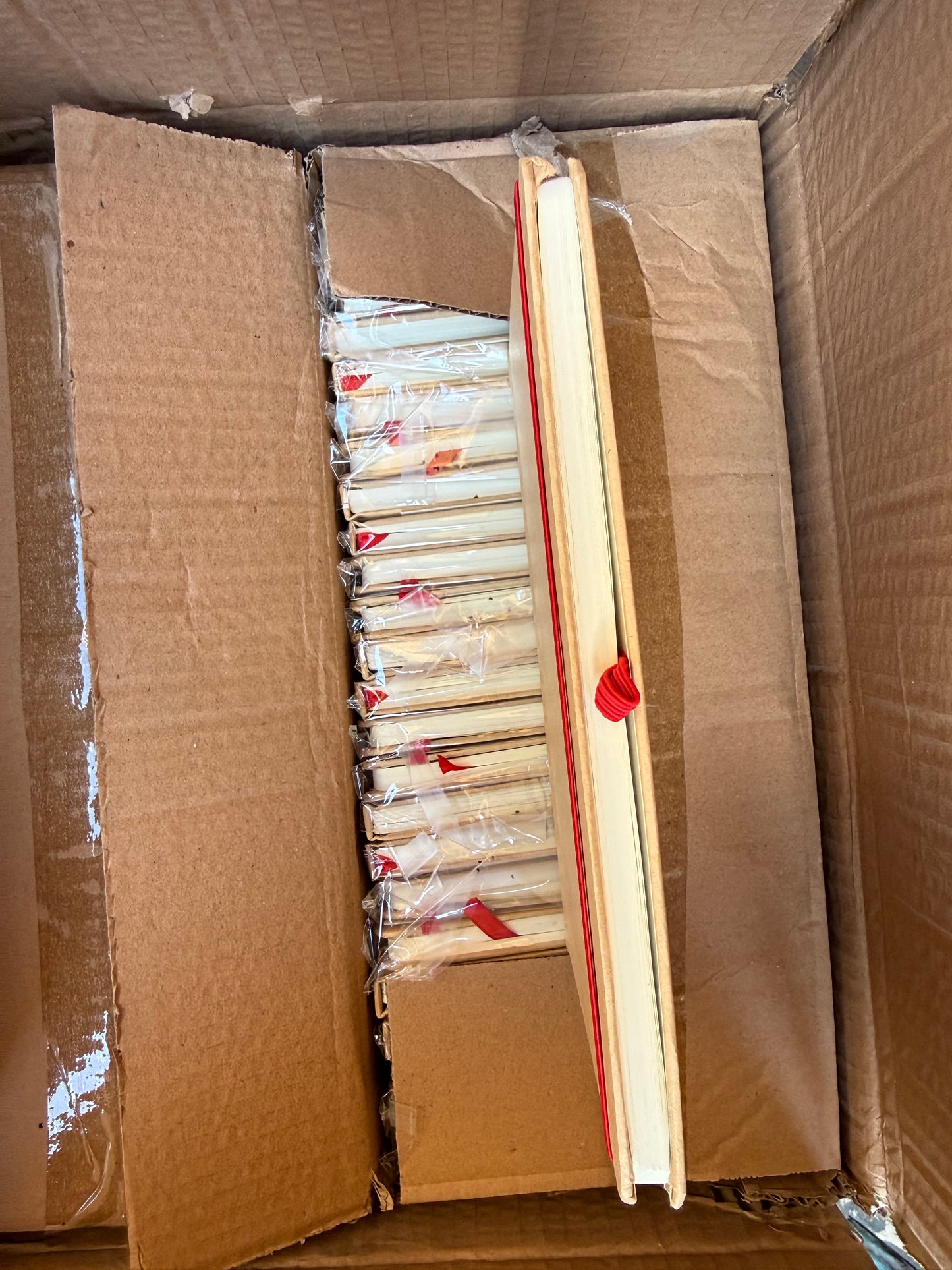 Box of 50 A5 hardback notebooks with coloured closure