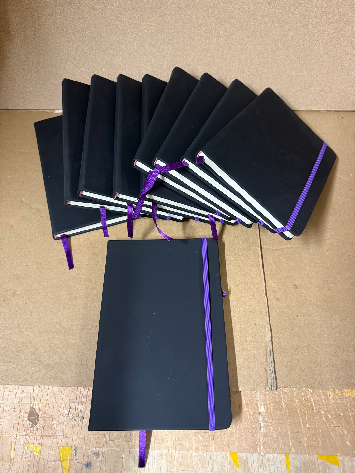 Bundle of Black A5 PU hardbacked notebooks with coloured closure