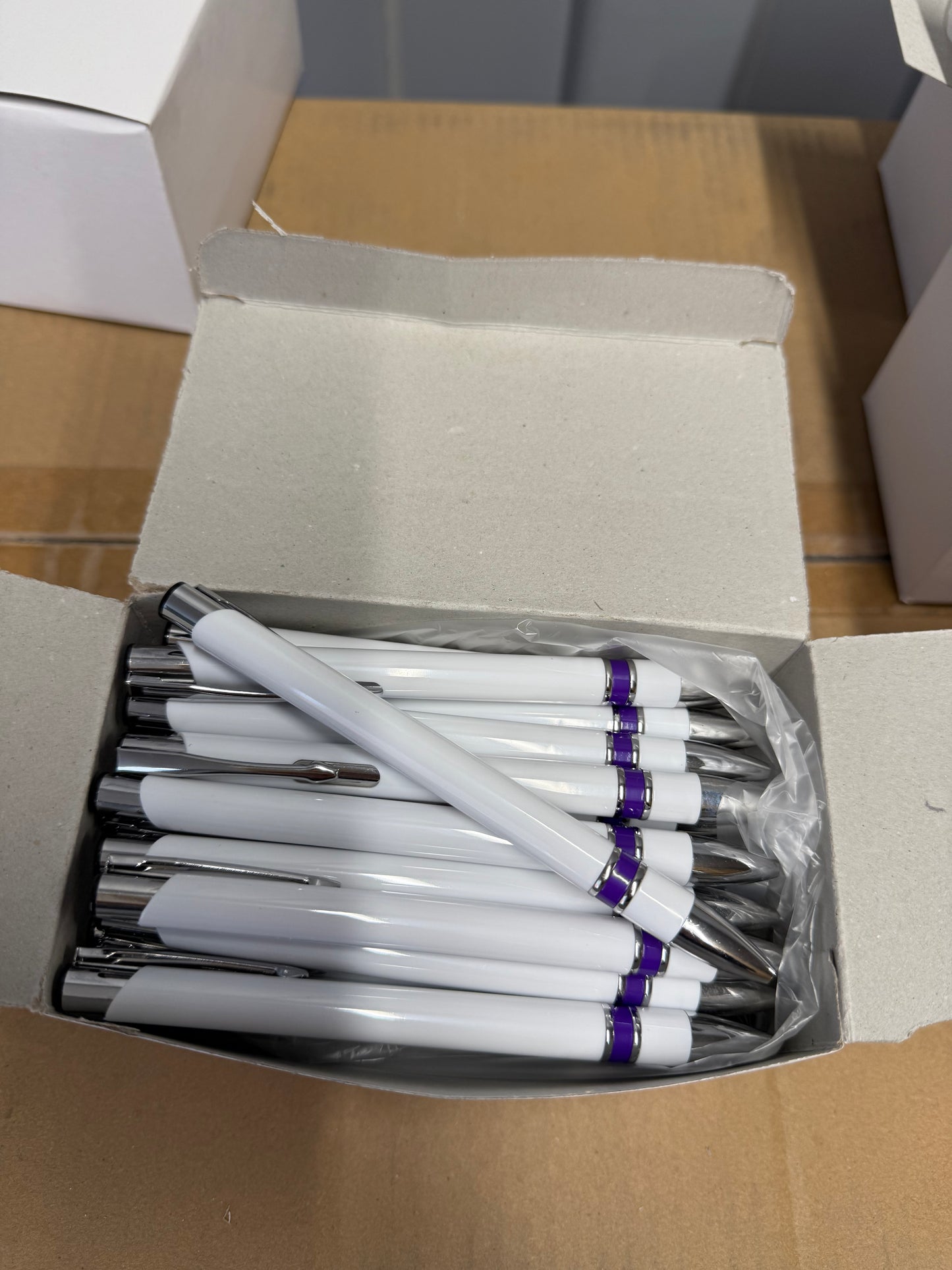 Box of 50 Black ink ball point pens with purple plastic trim