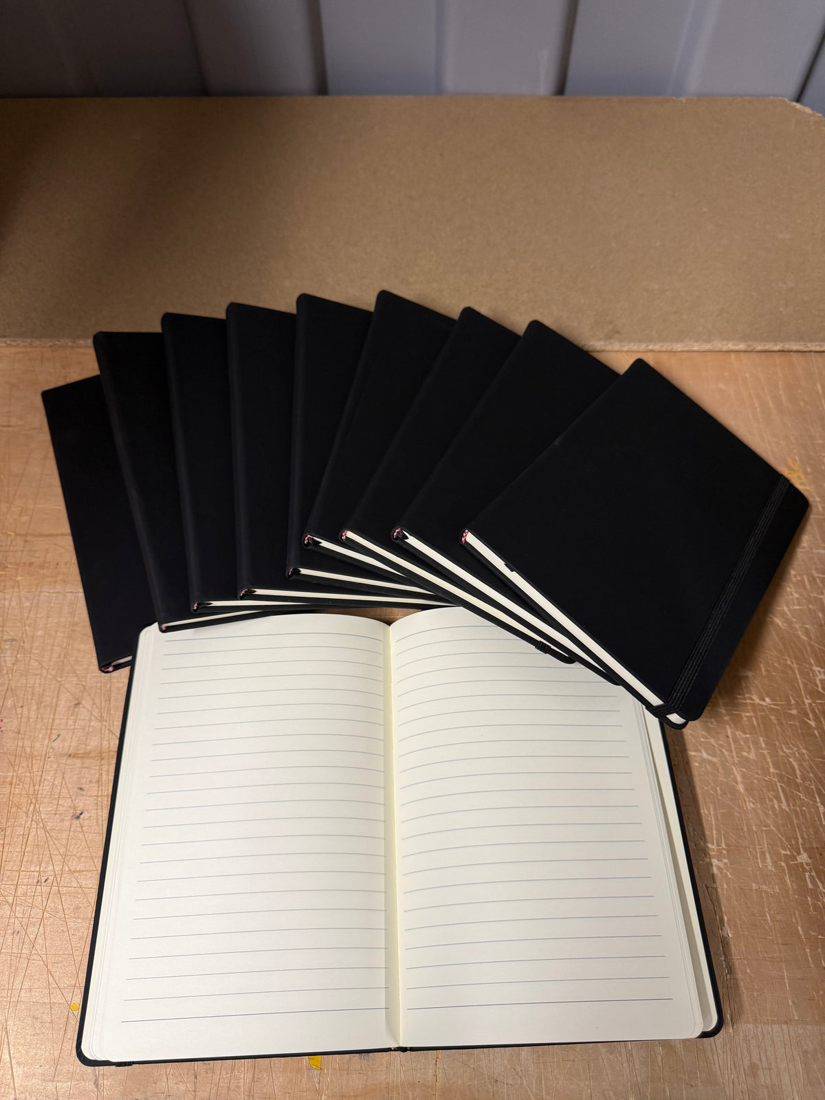 A5 PU hardback notebooks with elastic closure, bundles of 10 or full boxes of 50