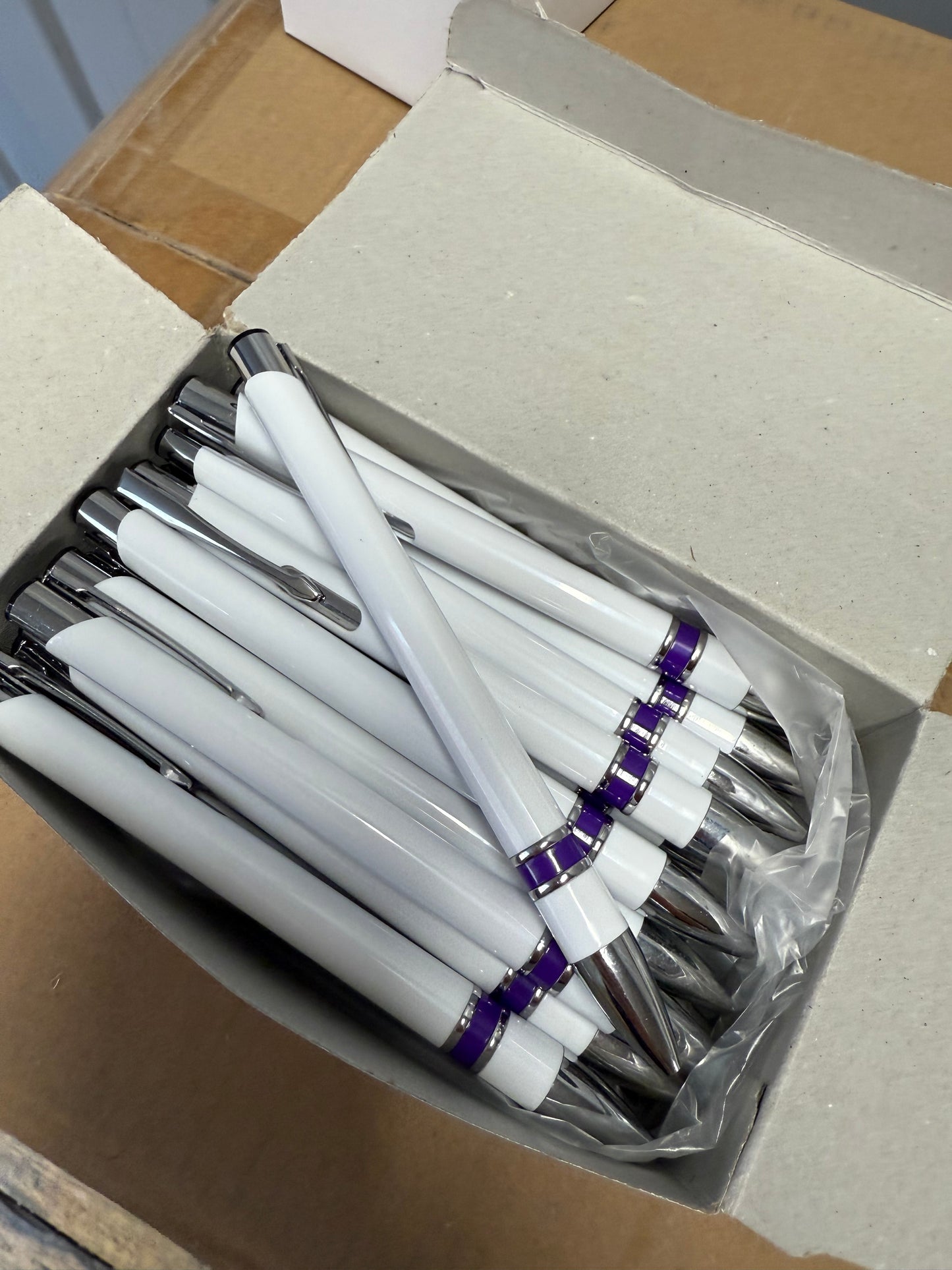Box of 50 Black ink ball point pens with purple plastic trim