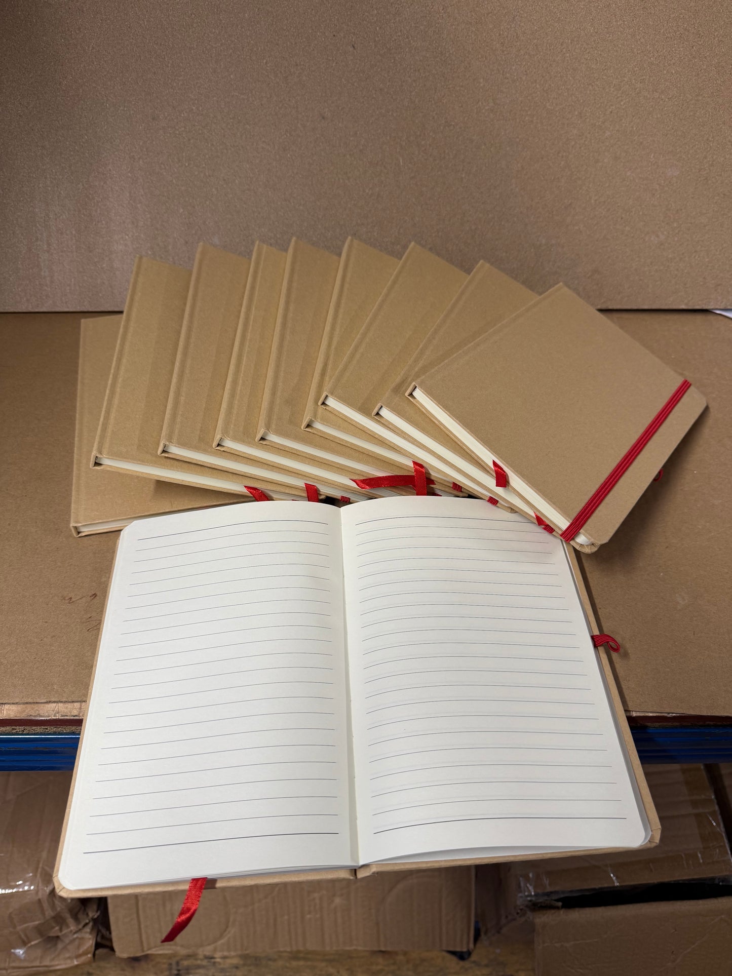 Bundle of A5 hardback notebooks with coloured closure