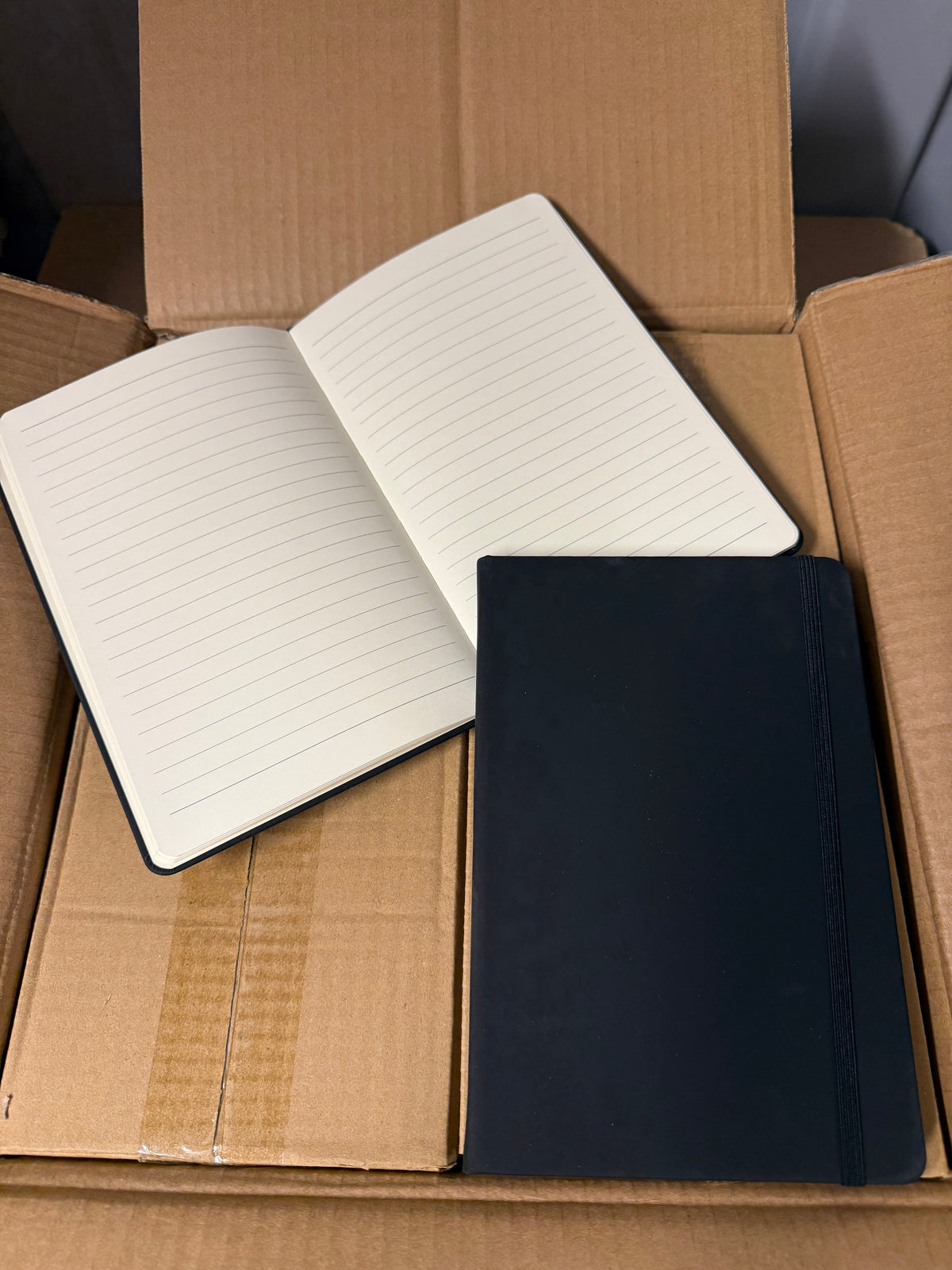 A5 PU hardback notebooks with elastic closure, bundles of 10 or full boxes of 50