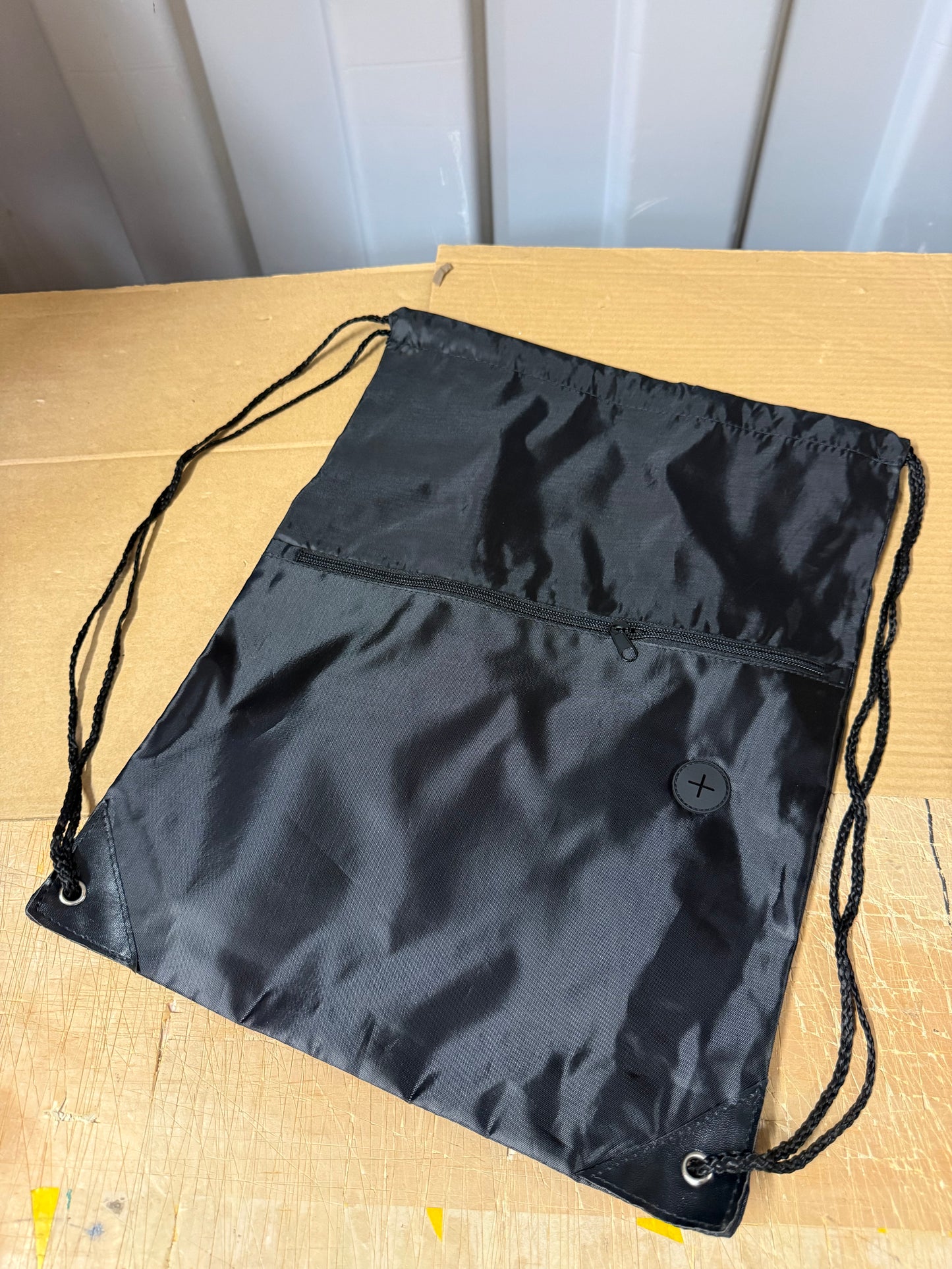 Pack of 50 Black drawstring sports bags with zip compartments