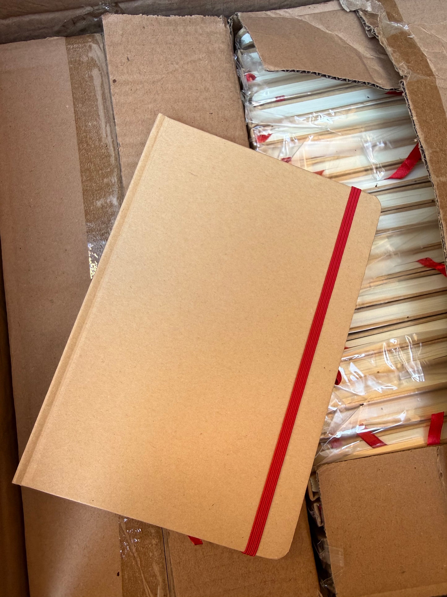Box of 50 A5 hardback notebooks with coloured closure