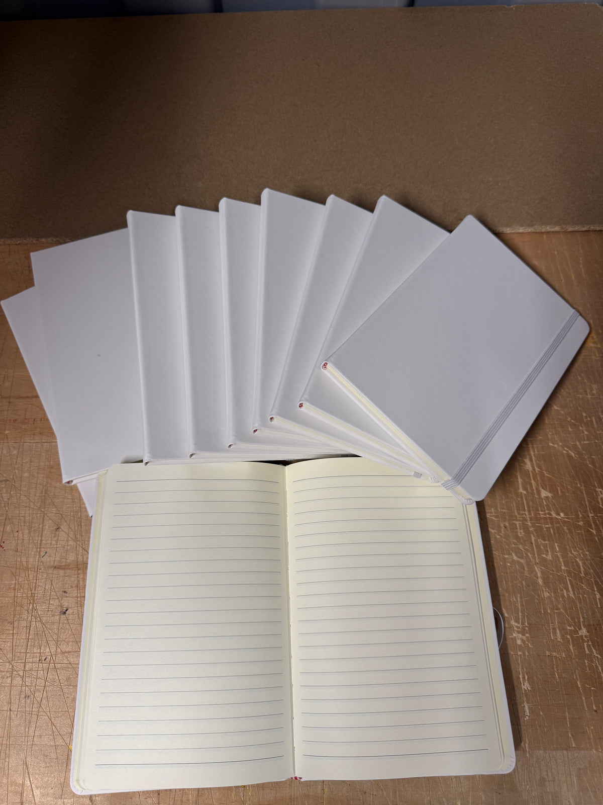A5 PU hardback notebooks with elastic closure, bundles of 10 or full boxes of 50