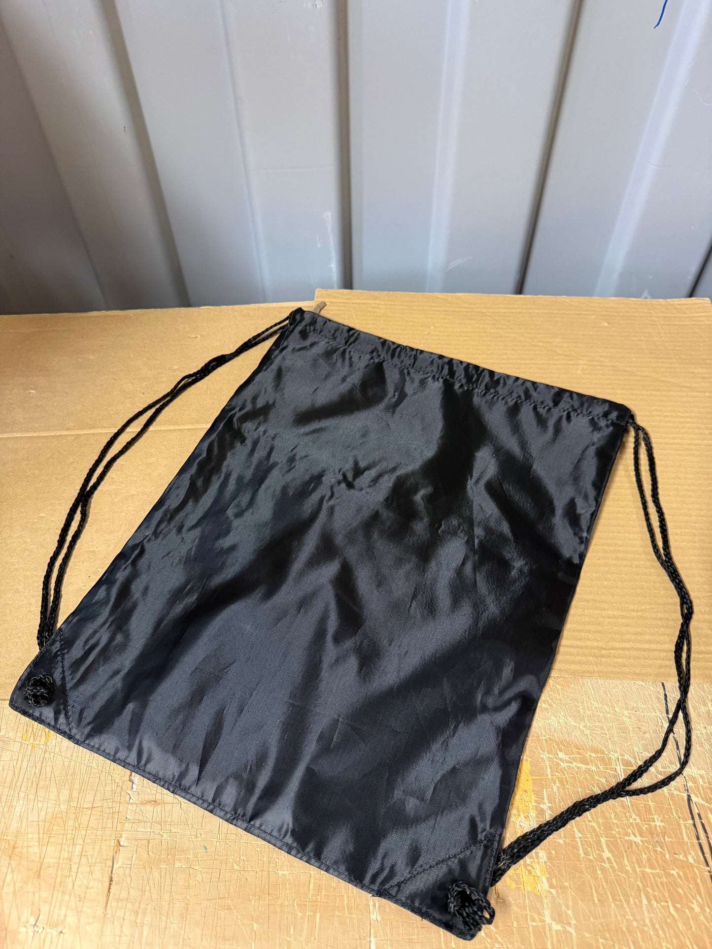 Pack of 50 Black drawstring sports bags with zip compartments