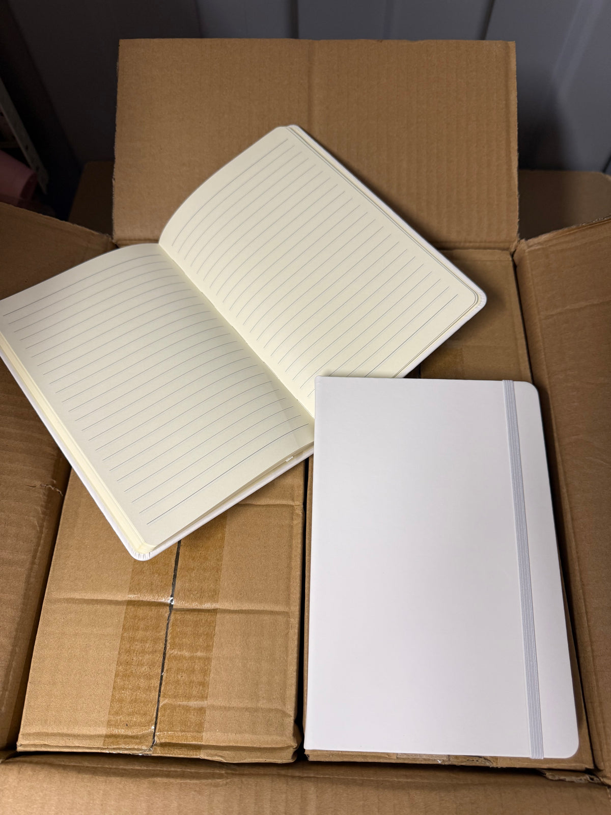 A5 PU hardback notebooks with elastic closure, bundles of 10 or full boxes of 50