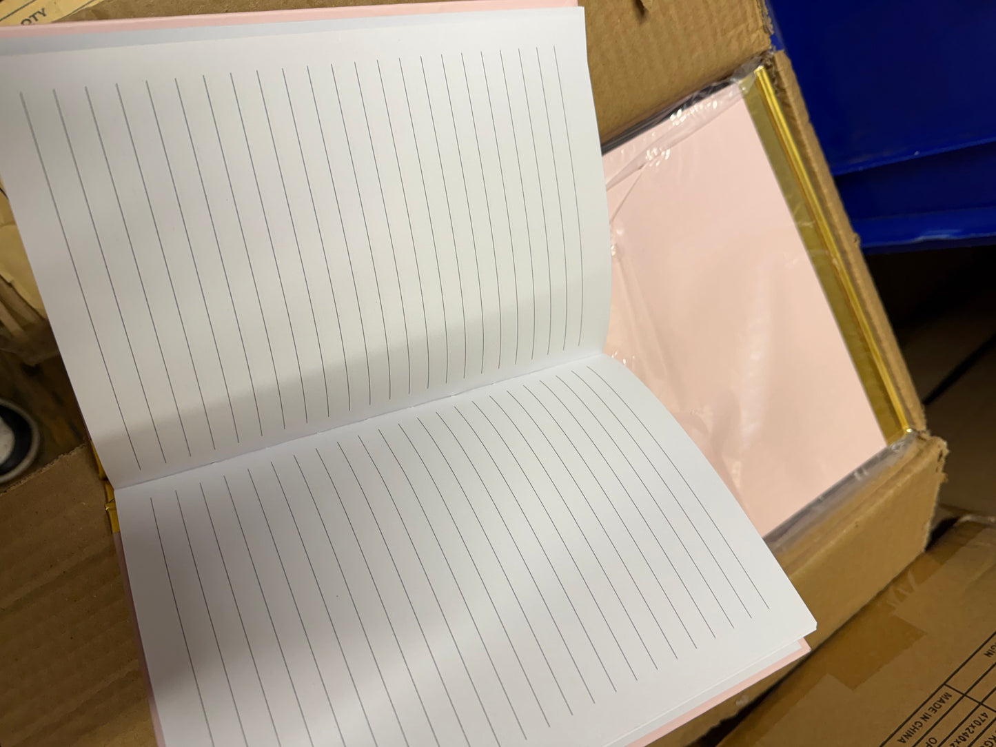 Box of 40 A5 pink hardback notebooks with gold trim